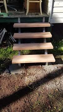 Timber deck steps with painted stringers