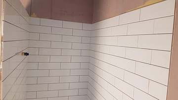 Subway tiled bathroom wall