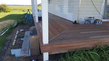 New merbau deck boards laid alongside a house